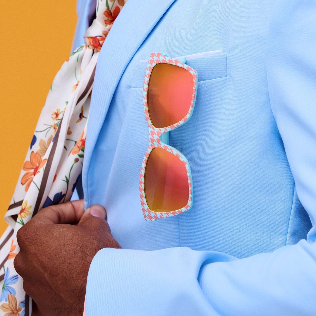 Polarized Pop G sunglasses from Rare Air Discs with houndstooth packaging, featuring sleek frame and tinted lenses for stylish eye protection.