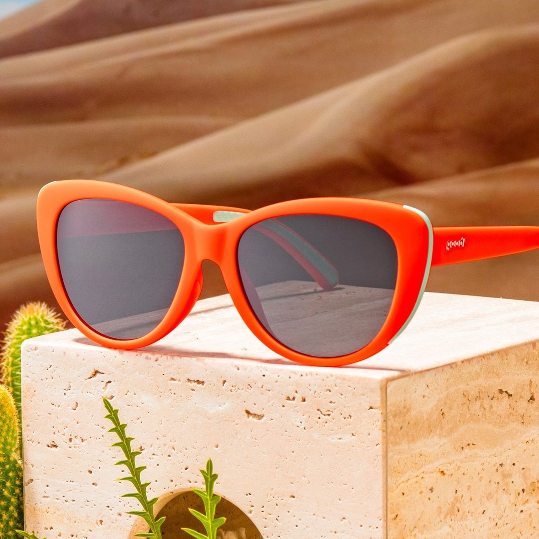 Orange glam polarized sunglasses with cherry stem and tongue design from Rare Air Discs, showcasing trendy accessory style.