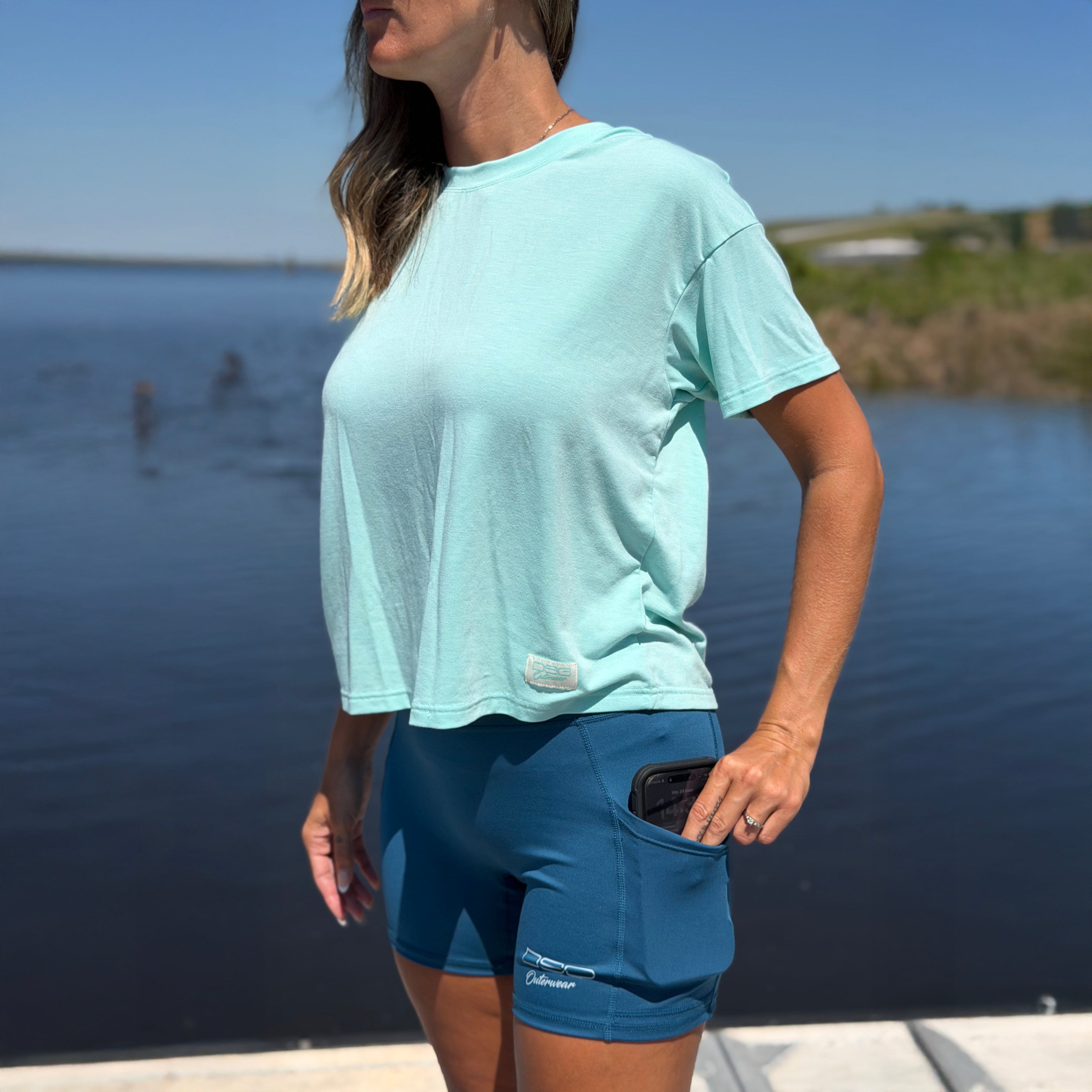 DSG OUTERWEAR active short in black with elastic waistband, shown on a hanger against a white background.