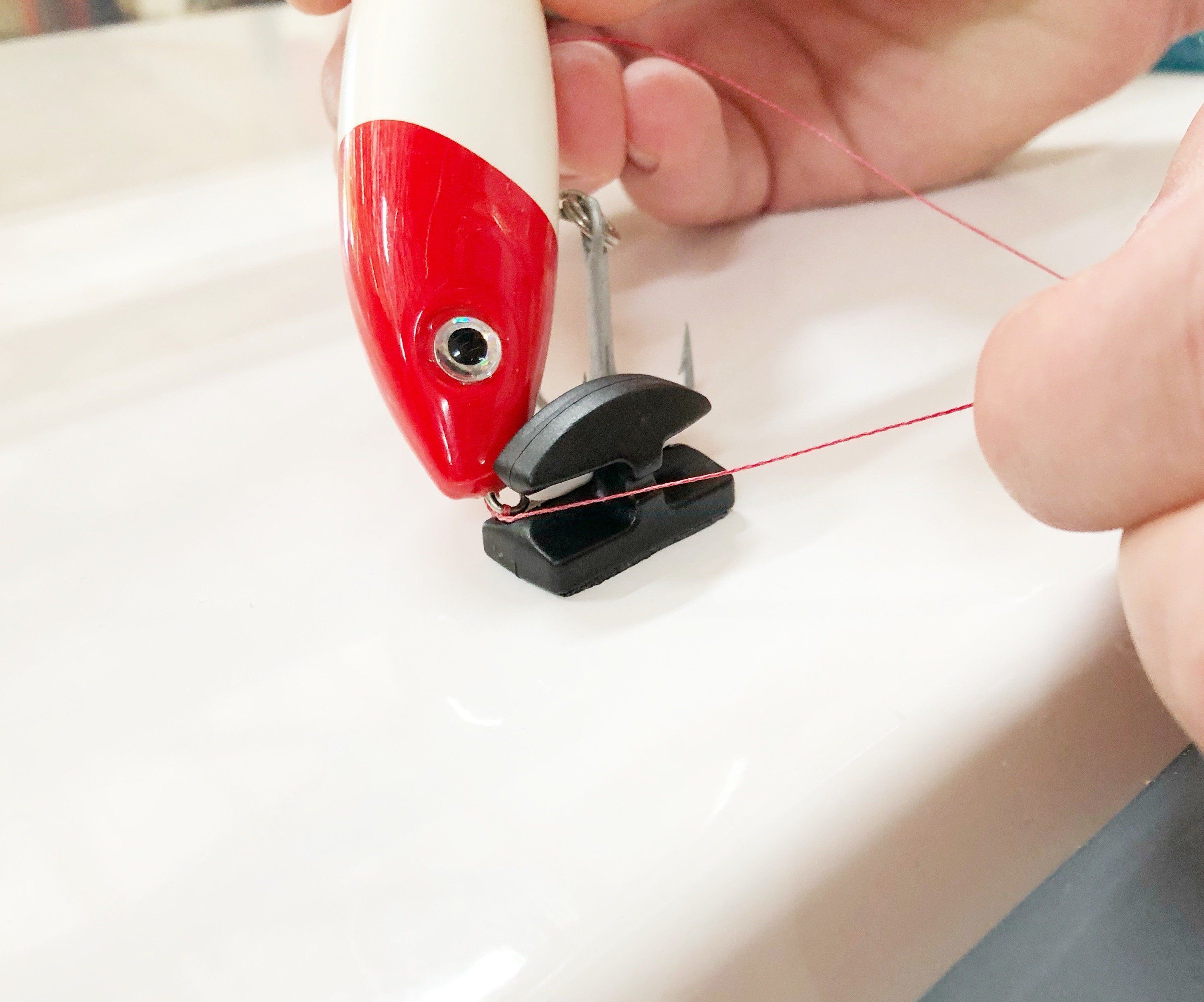 Line Cutterz Triple Play fishing line cutter multi-pack with four combo cutters, compact and durable for outdoor fishing use.