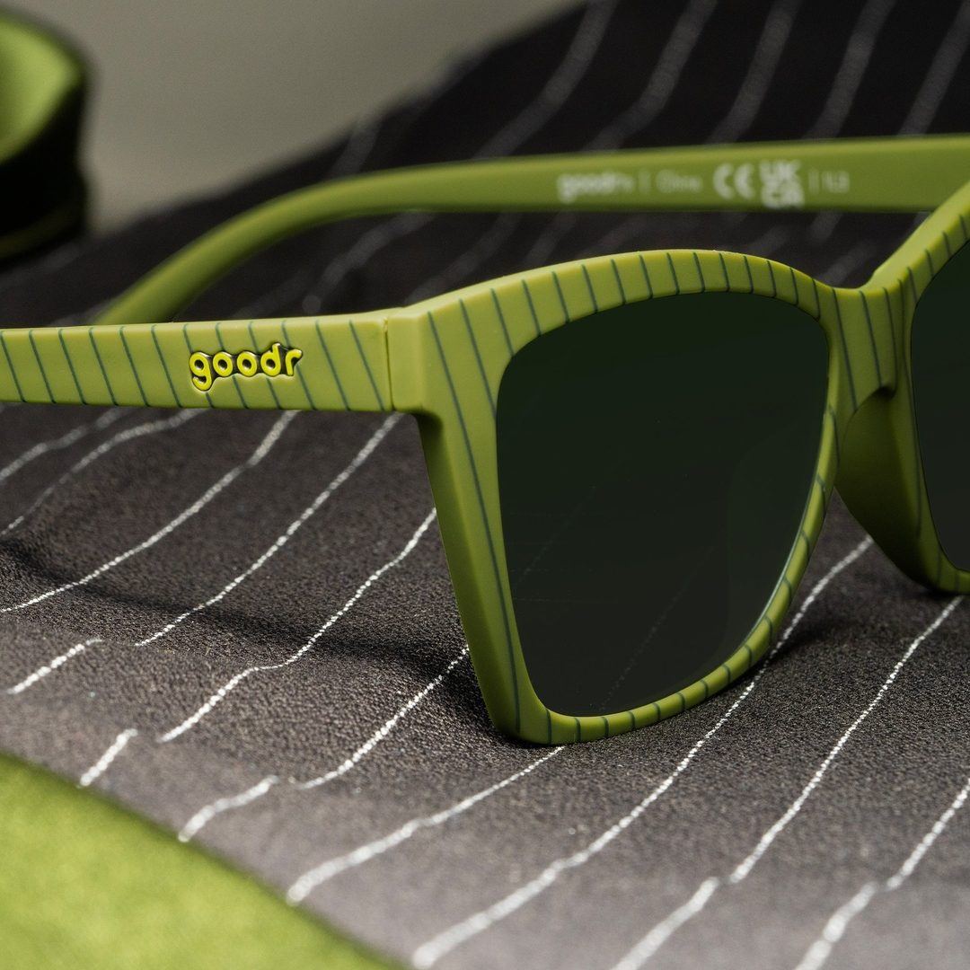 Pair of Rare Air Discs Swirls Martini, Becomes Icon polarized sunglasses with colorful swirl design in sleek packaging.