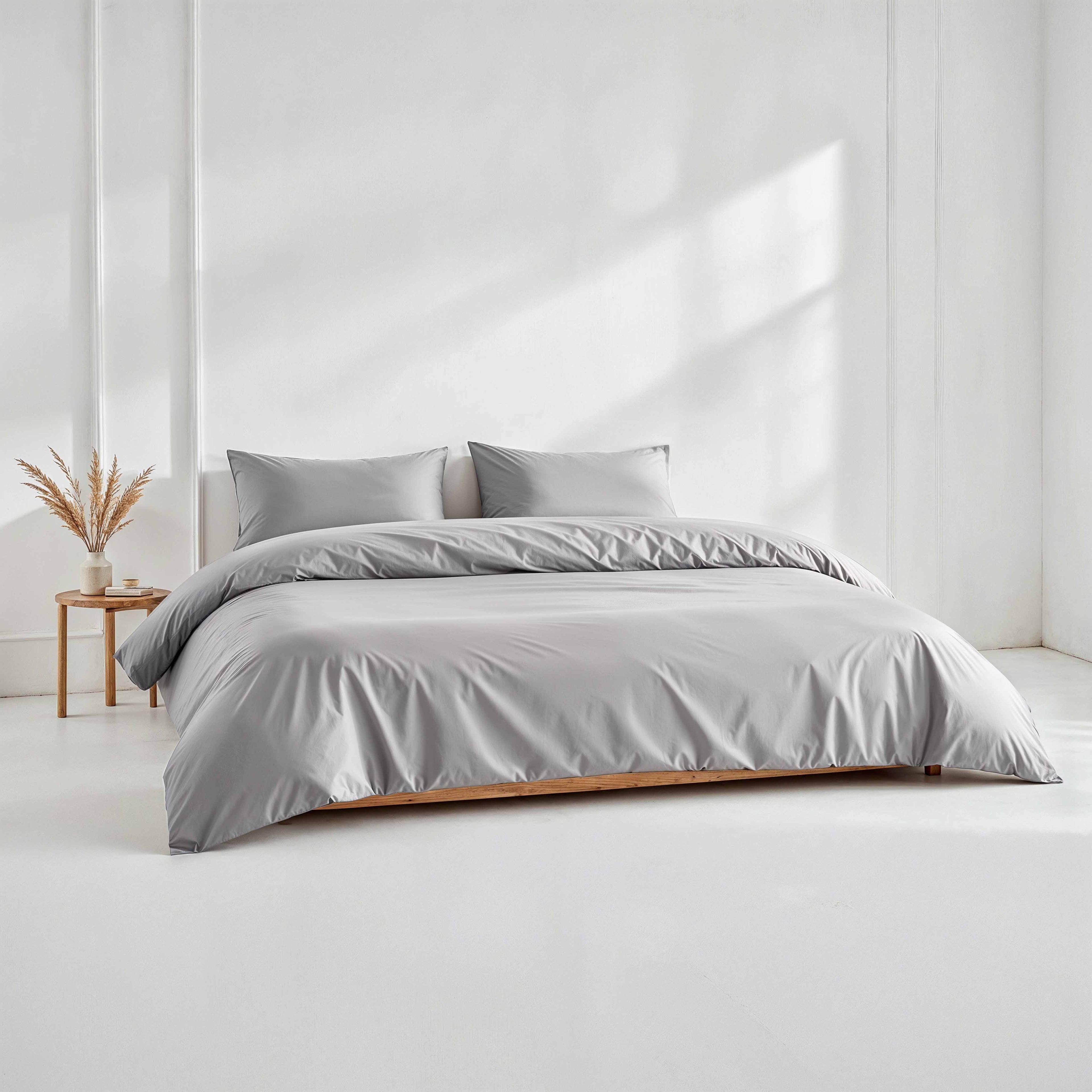 Elegant white Luxe Australian Sateen Duvet Cover by Italic, showcasing smooth fabric and clean stitching on a neatly made bed.