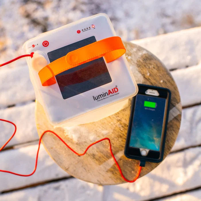 Alpenglow Readiness Supply PackLite Max 2-in-1 Power Lantern illuminating a campsite at night with a soft glow.