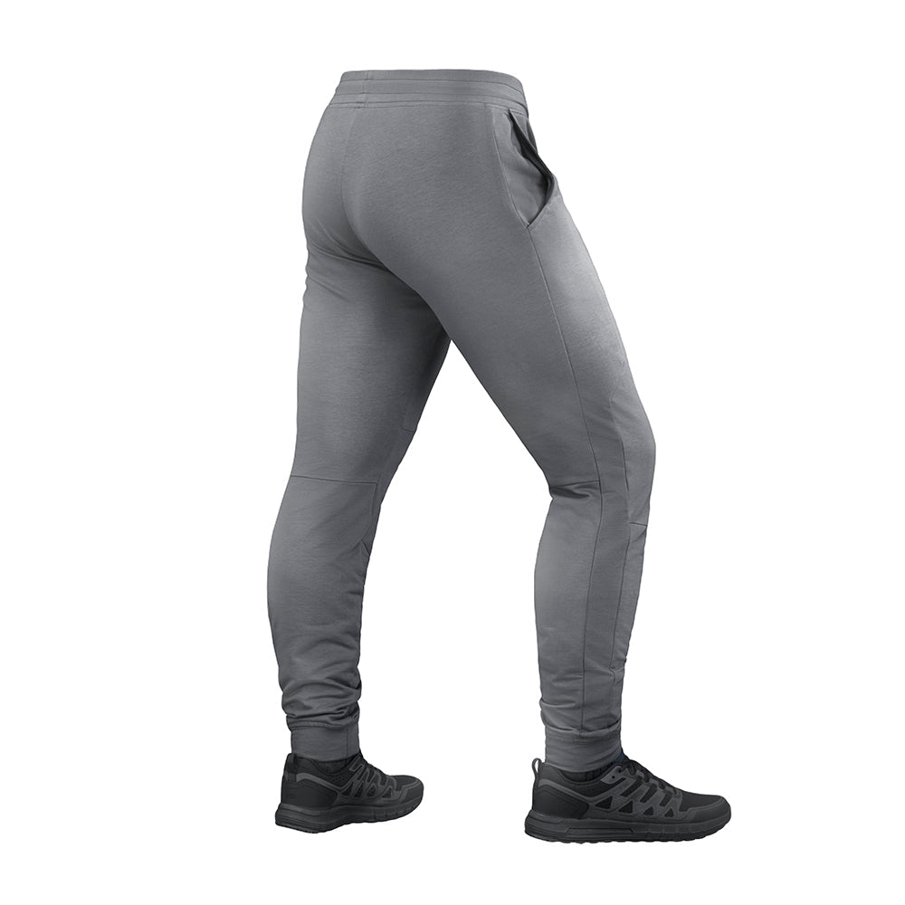 M-Tac Stealth Active sweat pants with a slim fit design, made of durable fabric, featuring side pockets and an adjustable waistband.