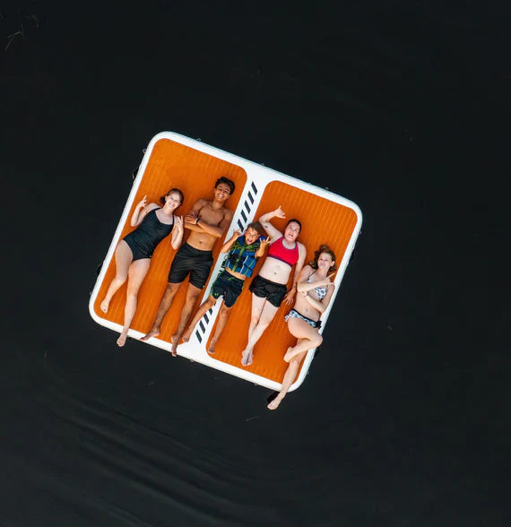 Backcountry Sportsman inflatable dock and swim platform, shown in a close-up image with bright blue and white colors and textured surface.