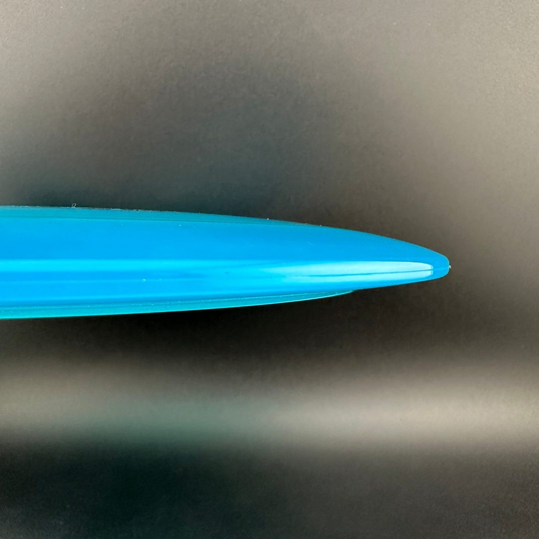 Rare Air Discs Gummy C-Blend Aztec disc golf disc from the FEAR V1 series by Les White, showing bright orange and black design.