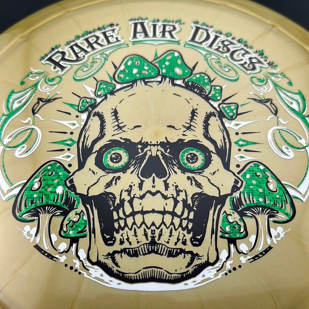 Ethereal Construct Crushin' Amanitas disc golf stamp by Manny Trujillo on a disc from Rare Air Discs, featuring mushroom illustrations.