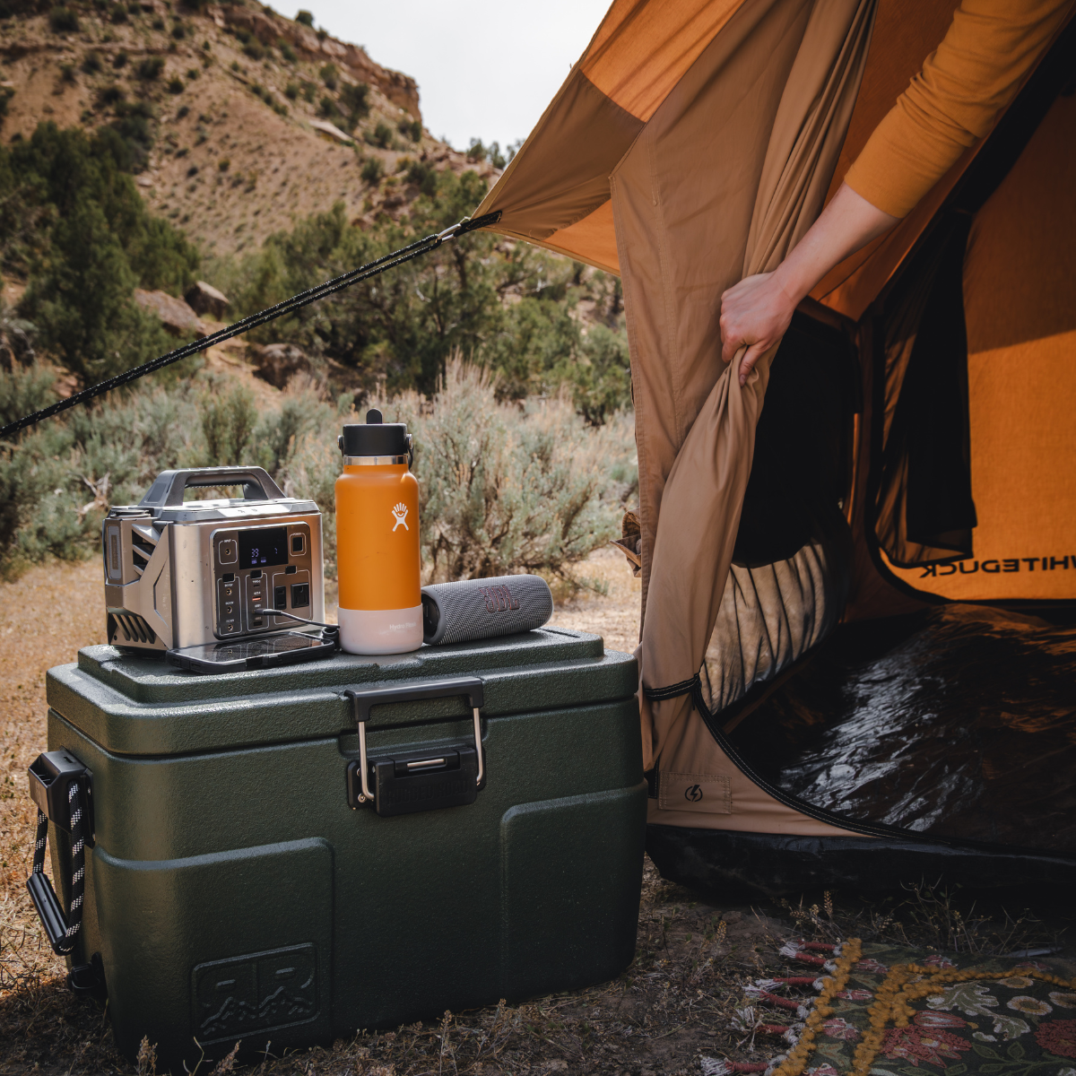 White Duck Outdoors Rover Scout Tent in 6x8 feet, durable canvas camping tent set up outdoors with open flaps and sturdy frame.