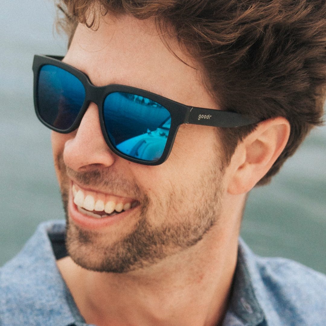 Rare Air Discs "Buoys Don't Cry" tidal G polarized sunglasses floating on water, showcasing durable accessories with polarized lenses.