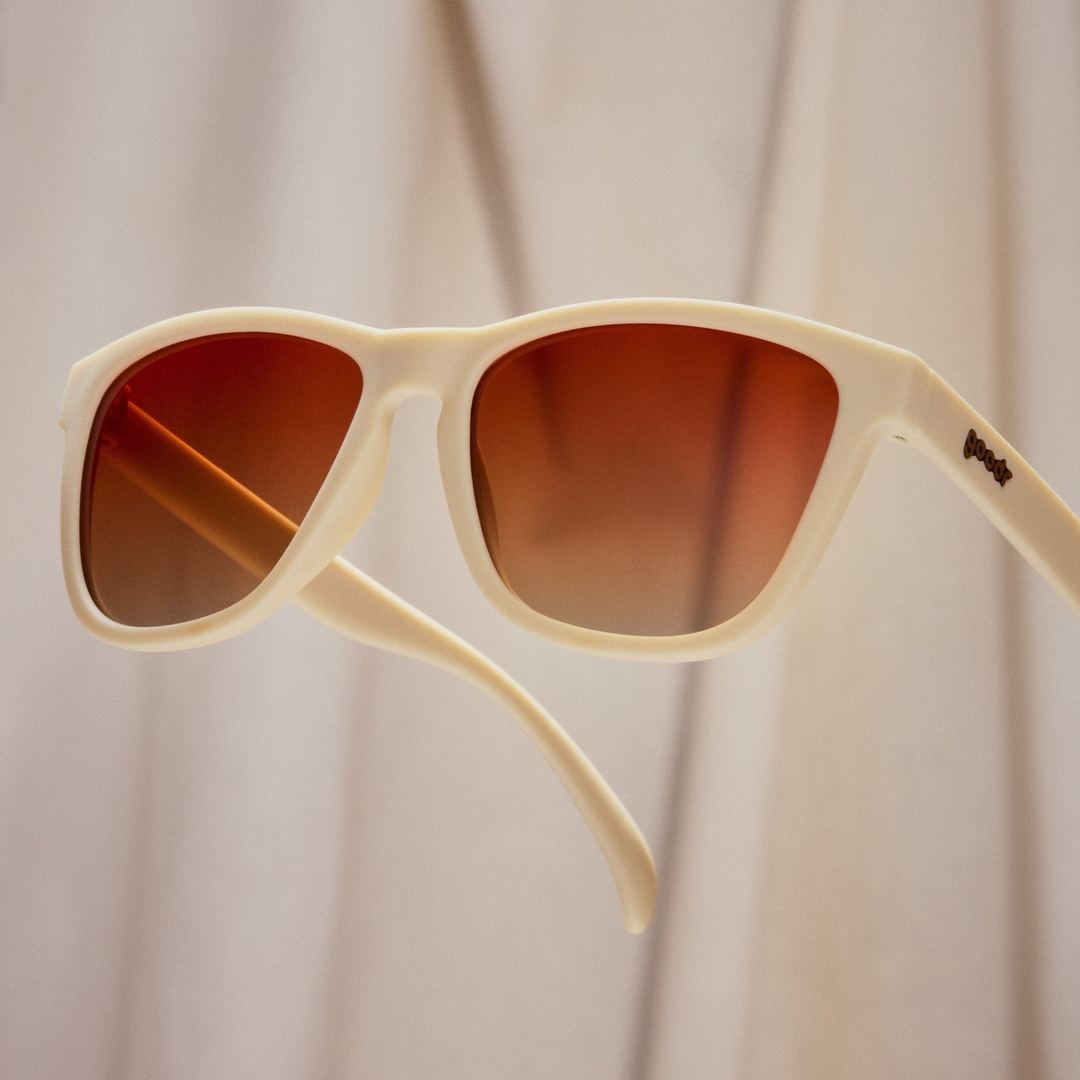 Rare Air Discs Toasted Marshmallow Magic polarized sunglasses with black frame and tinted lenses, stylish accessories for outdoor wear.