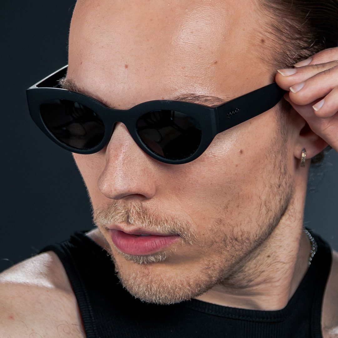 Rare Air Discs "In My Cosmic Era" Moon G polarized sunglasses with dark lenses and black frames, accessory for stylish sun protection.
