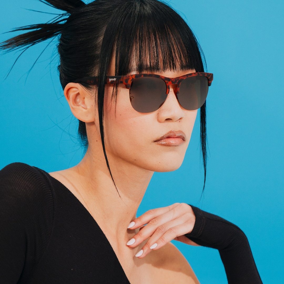 Rare Air Discs Positively Cosmopolitan Avant G Polarized sunglasses with sleek black frames and tinted lenses.