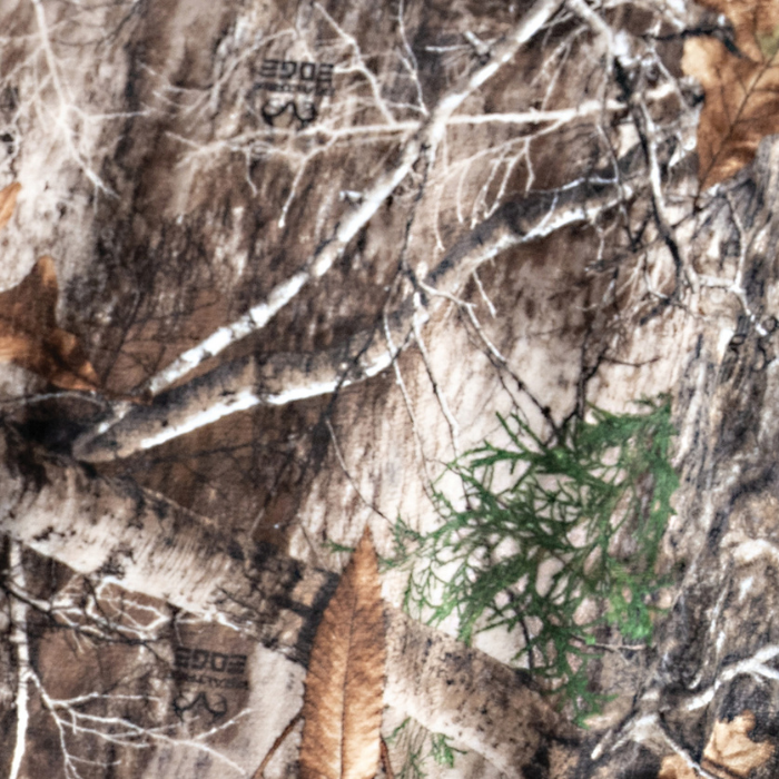 City Bonfires Realtree Edge camo chair blanket draped over a chair, showcasing the cozy, camouflage design and soft fabric.
