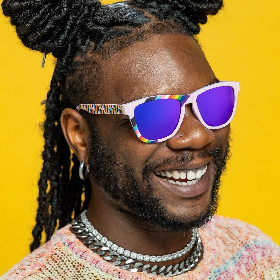 Polarized sunglasses with "We're Here To Slay" slogan by Rare Air Discs, featuring bold frames and vibrant design.
