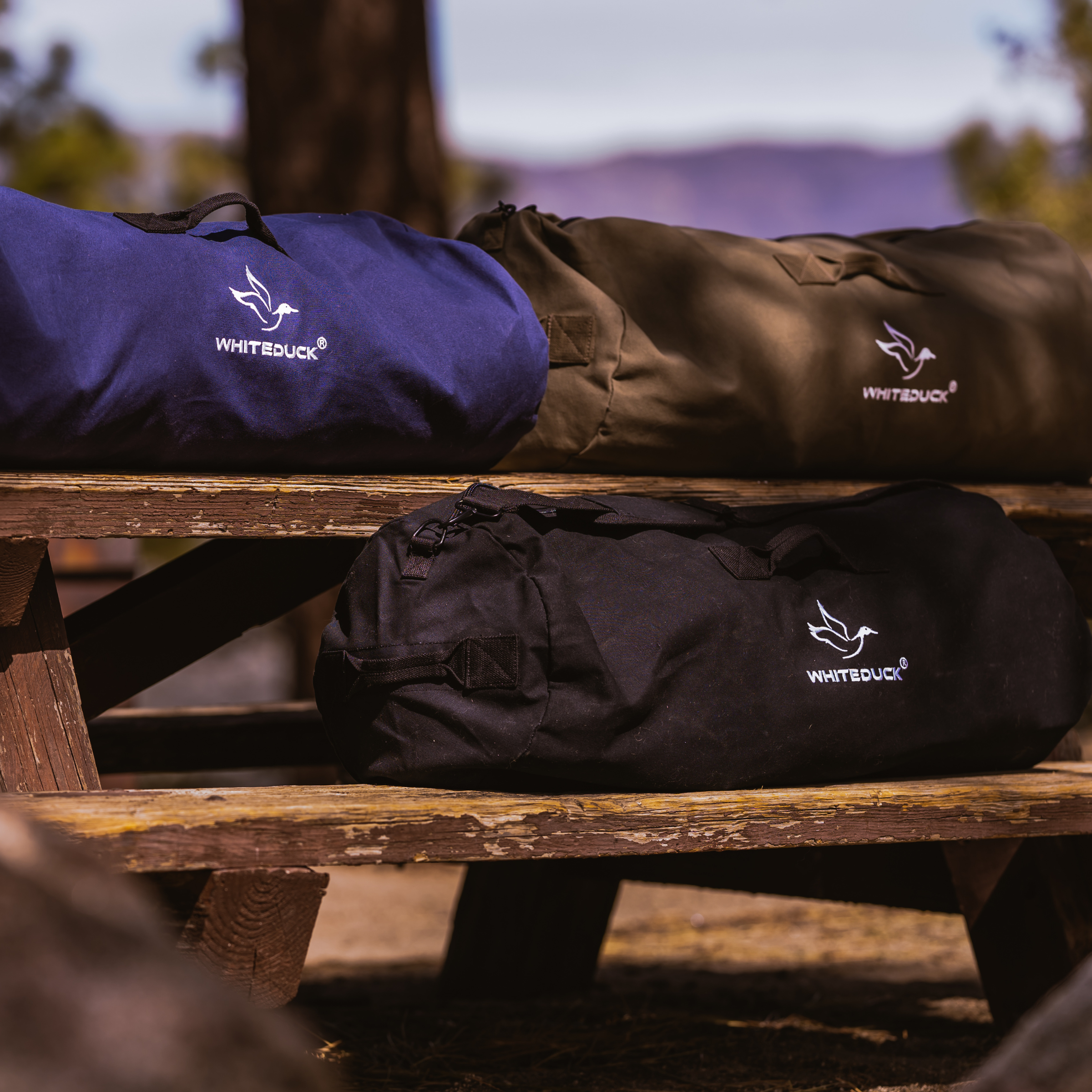 White Duck Outdoors Hoplite Canvas Duffel Bag with sturdy handles and spacious main compartment for travel or gym use.
