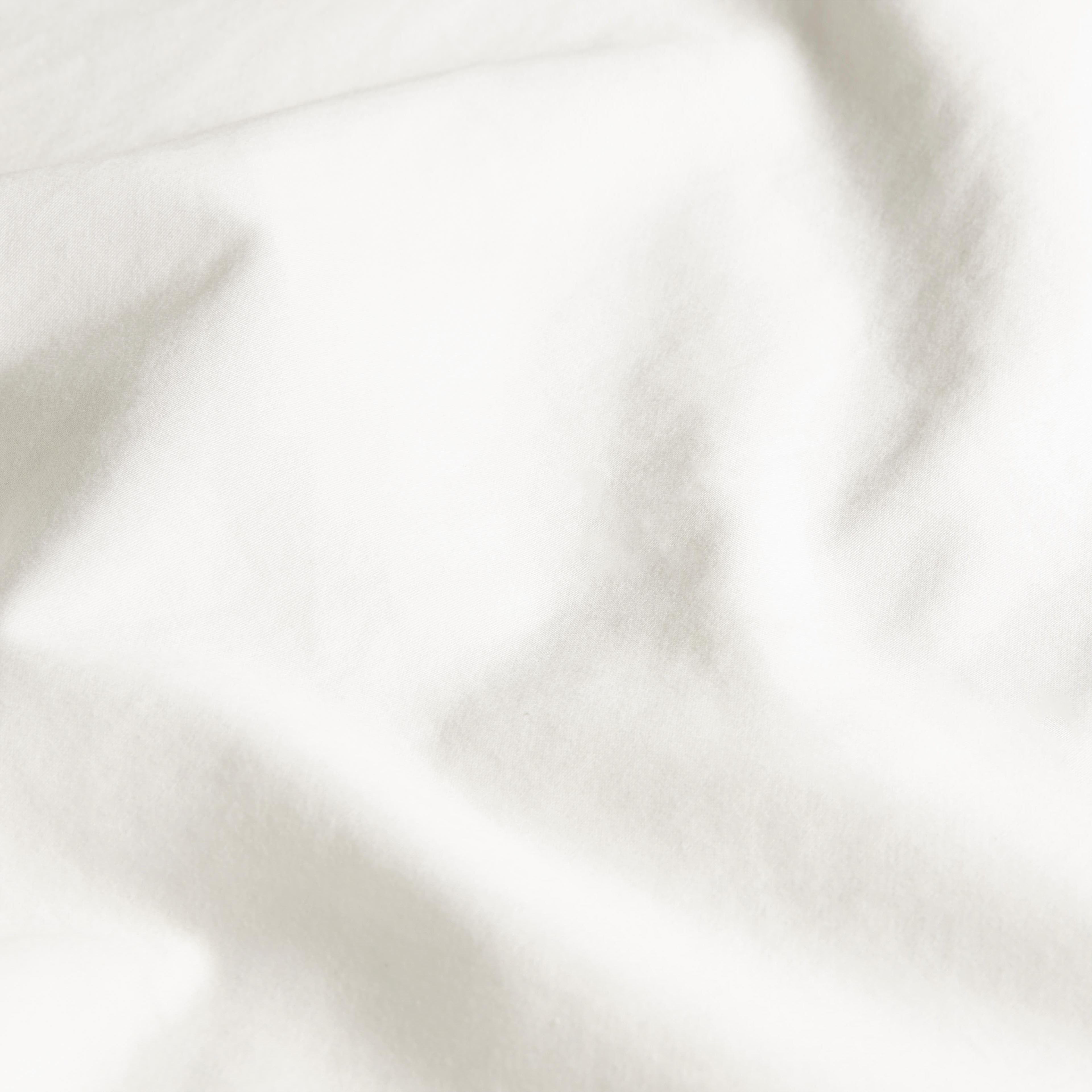 Cream Luxe Australian Sateen Duvet Cover by Italic, showing smooth, silky fabric with elegant stitching for a luxurious bed look.
