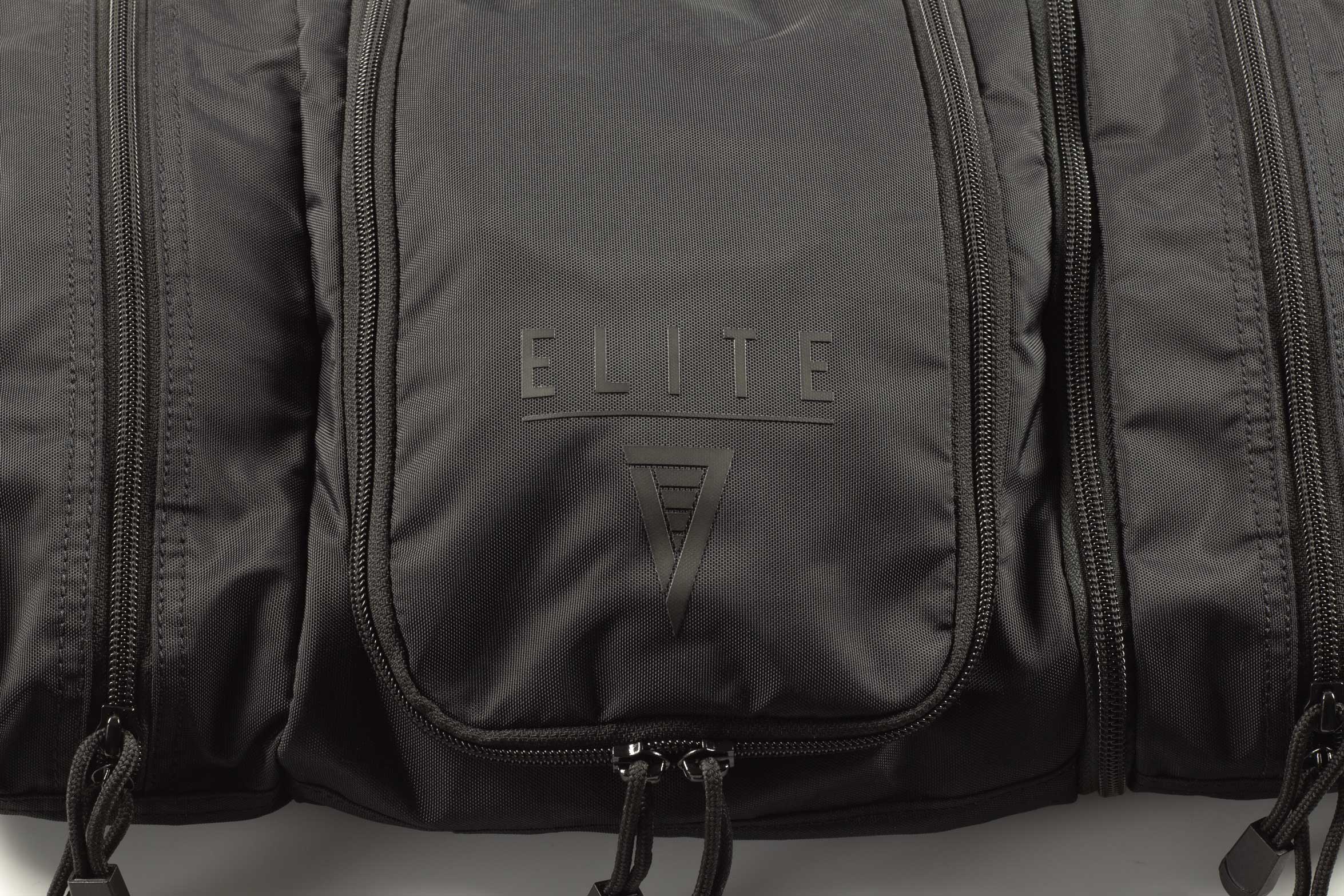 Close-up of Elite Survival Systems Travel Prone™ Toiletry Kit logo on luggage with a sleek design.