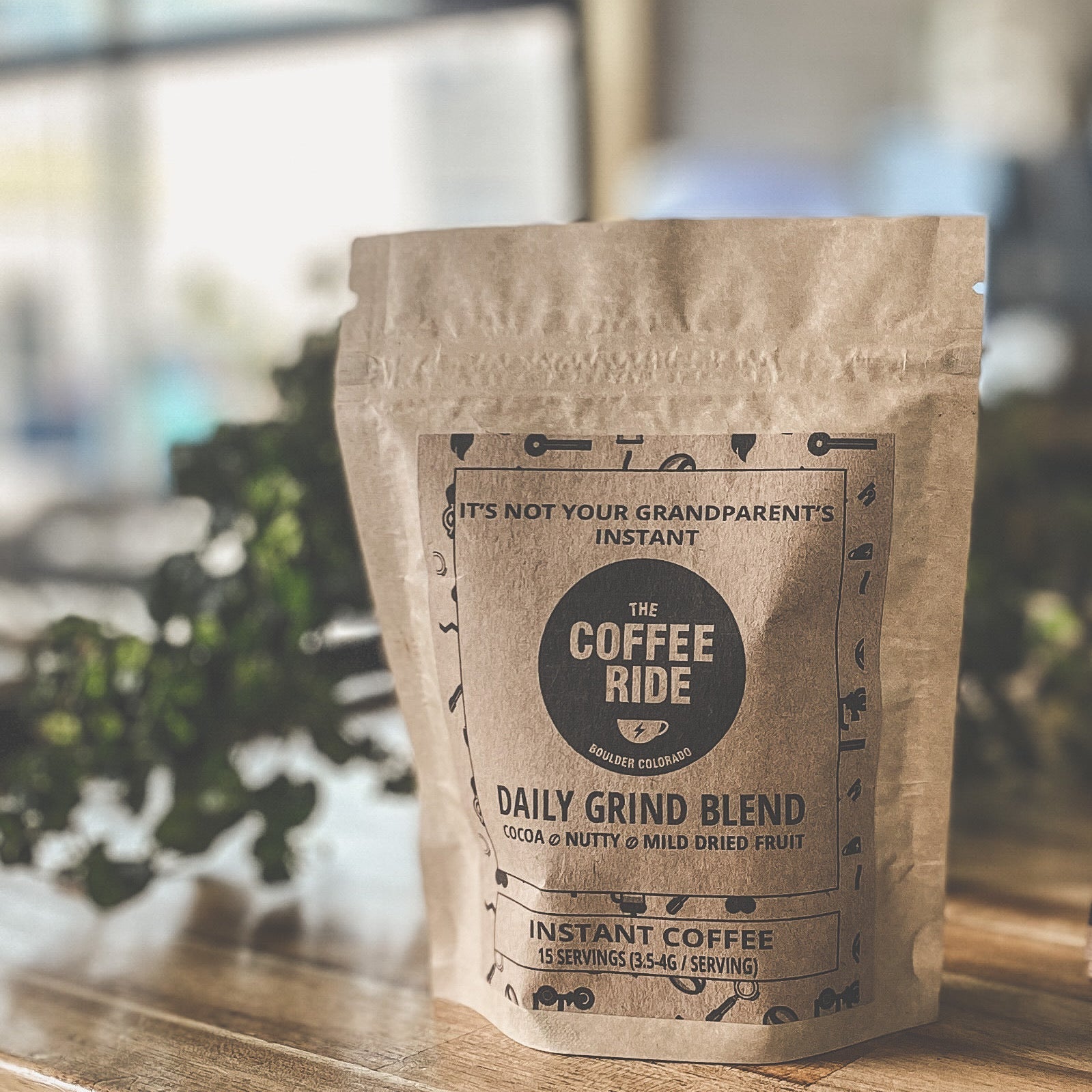 Bag of QUICK BREW COFFEE: THE GOLDEN TICKET by The Coffee Ride Coffee Roasting Co. with coffee beans and brewing equipment visible.