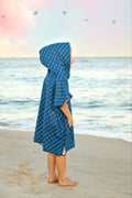 Blue microfiber fish-shaped waffle wearable towel by Keep the Littles Wild, shown draped and ready for use.