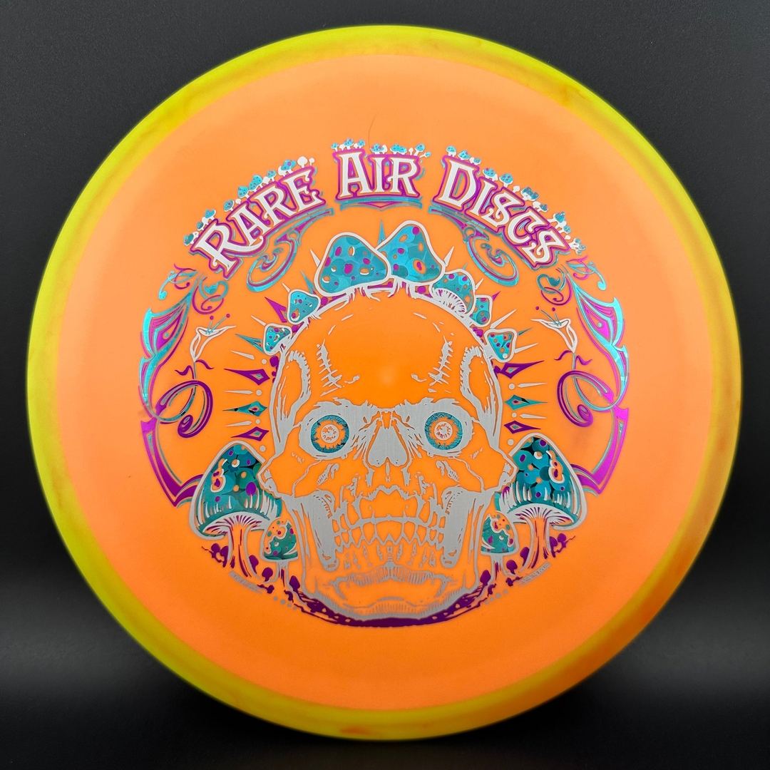Rare Air Discs Fission Defy Crushin' Amanitas VIP 2.0 disc golf disc with vibrant design and sturdy plastic, ideal for throwing.