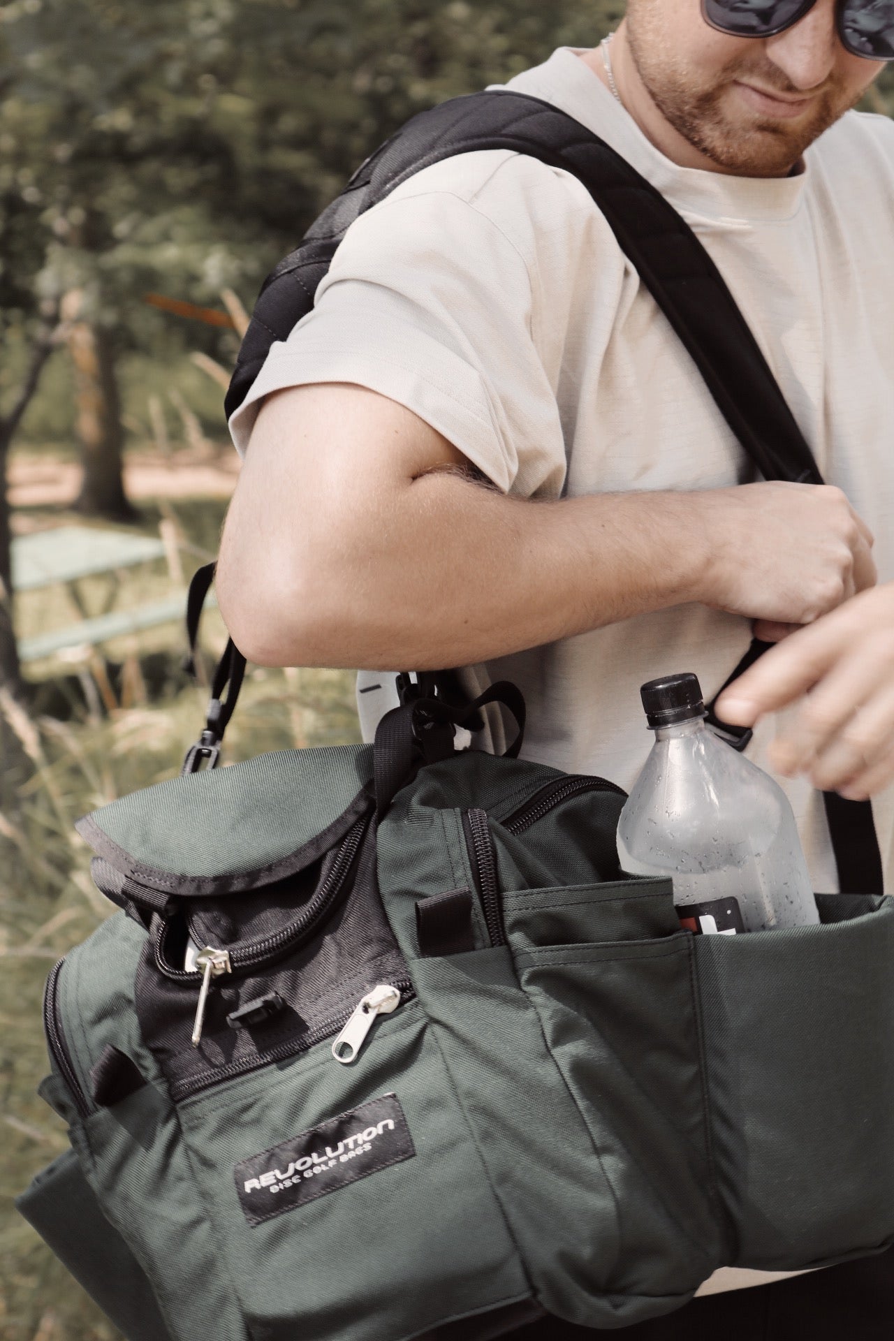 Gotta Go Gotta Throw Revolution Mini Deluxe V3 Disc Golf Bag in Mountain Mist, compact bag with multiple compartments for discs and gear.