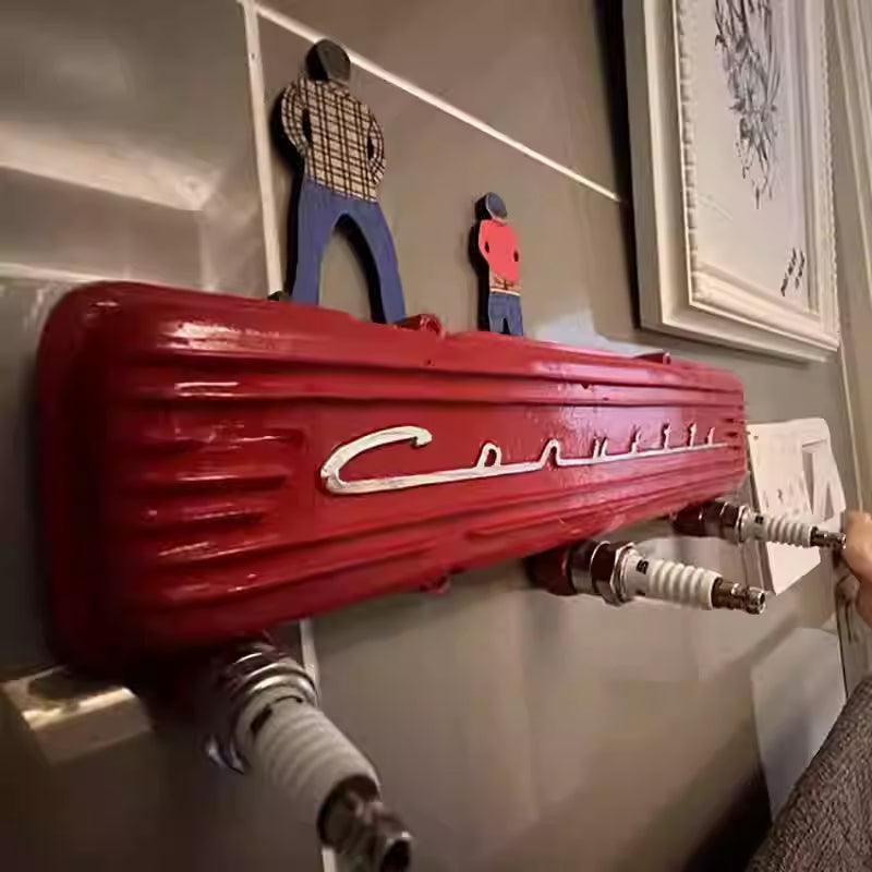 Vintage resin spark plug hook rack by Bean's Moto Booth, featuring a retro automotive-inspired design with multiple hooks.