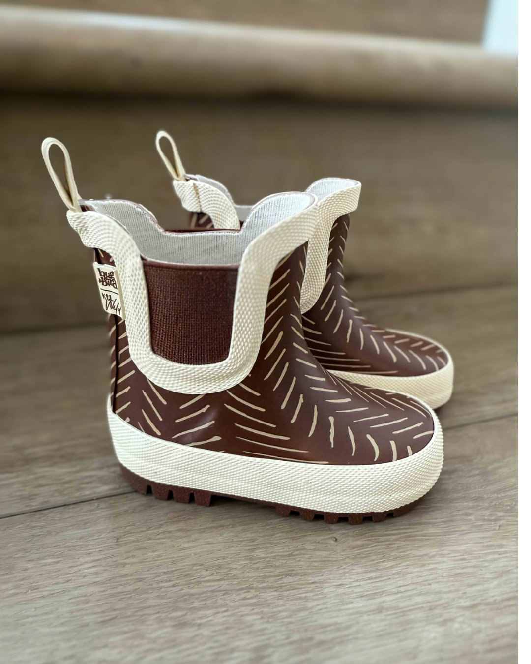 Keep the Littles Wild Summit rain boots in bright yellow with black soles, designed for kids' outdoor wet weather protection.