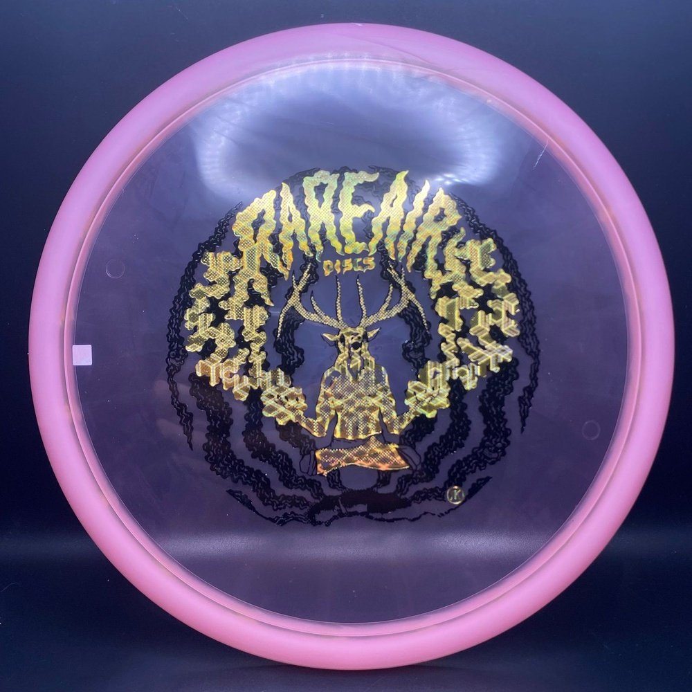 Eternal Mustang Midrange disc golf disc from Rare Air Discs featuring an elk stamp and vibrant orange color.