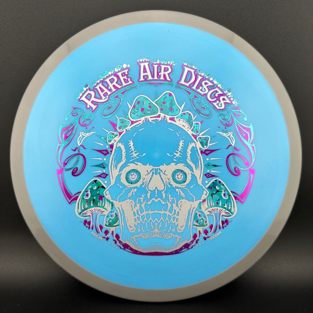 Rare Air Discs Fission Defy Crushin' Amanitas VIP 2.0 disc golf disc with colorful design and firm plastic finish.