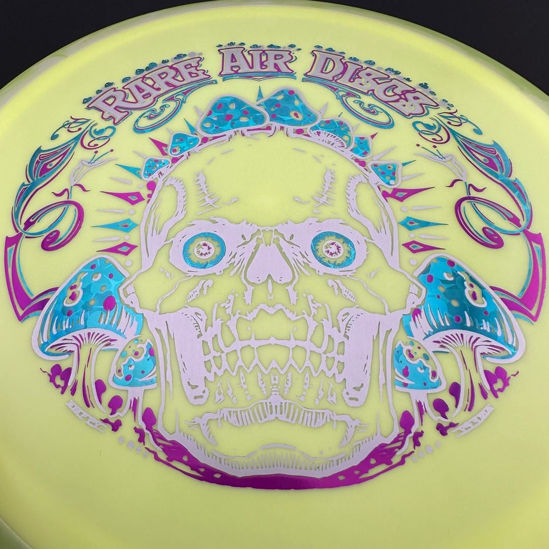 Rare Air Discs Fission Defy Crushin' Amanitas VIP 2.0 disc golf disc with vibrant design and bold branding on the flight surface.