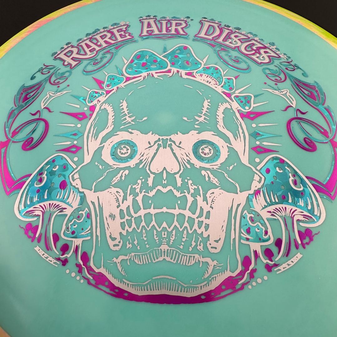 Rare Air Discs Fission Defy Crushin' Amanitas VIP 2.0 disc golf disc with vibrant design and bold branding on the flight surface.