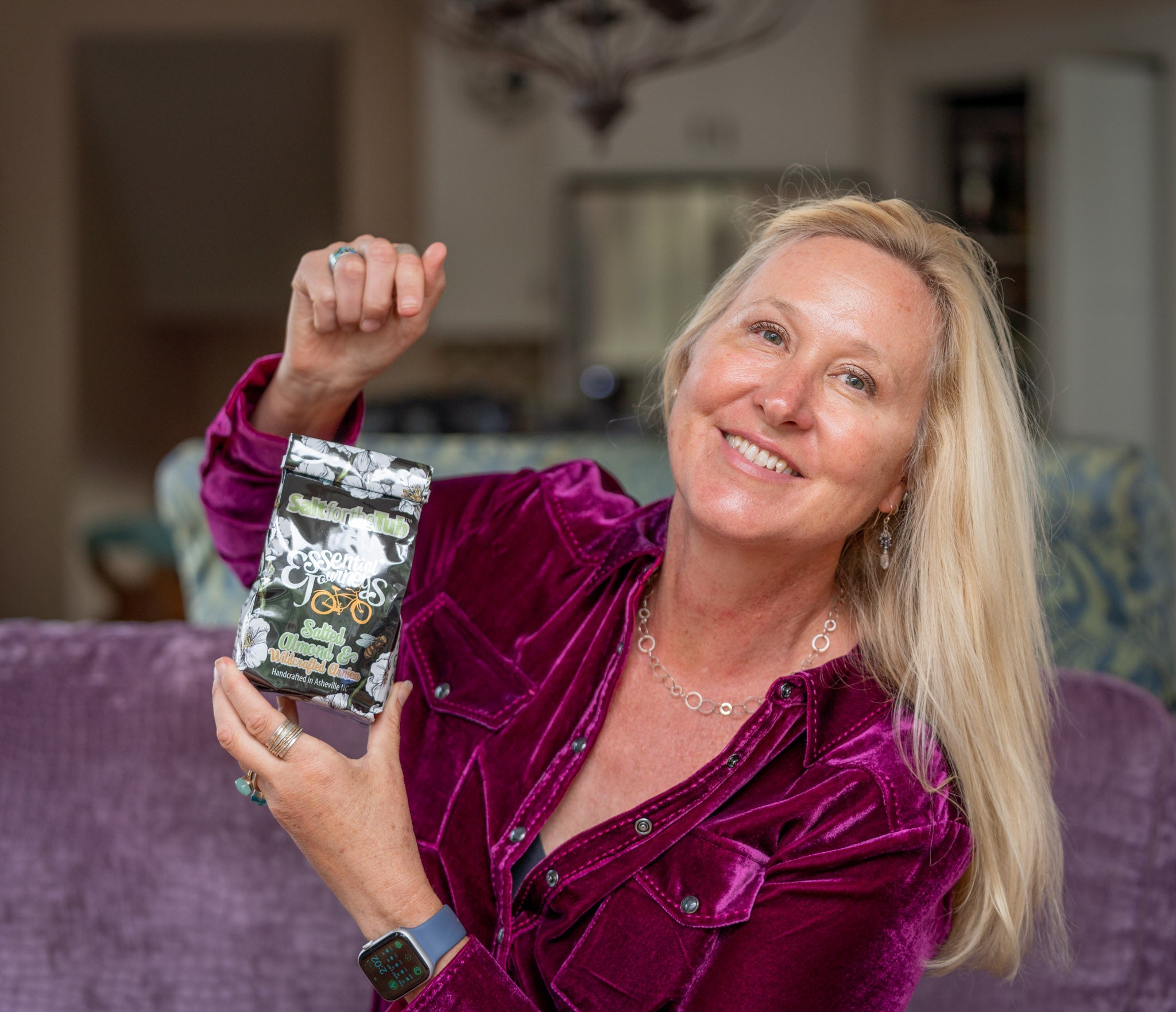 Essential Journeys salted almond and arnica bath salts in a jar, featuring natural almond and arnica ingredients for relaxing tub soaks.