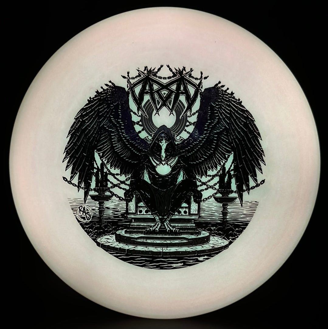 Disc golf disc from Rare Air Discs ESP Glo Buzzz series featuring Karudi the Overseer artwork, glowing in the dark.