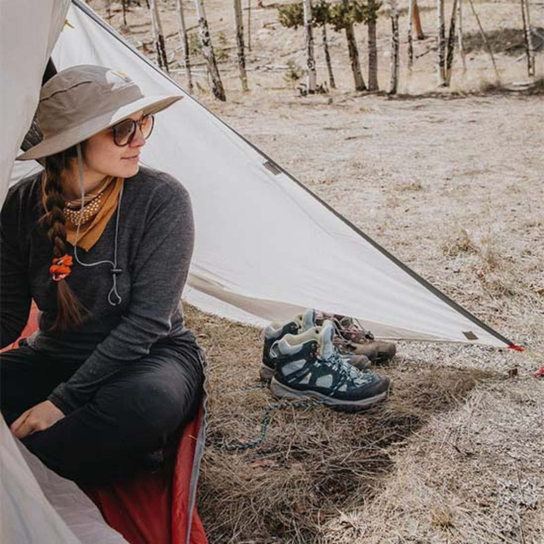 Near Zero Outdoor Gear 3P DynaLite Tent set up outdoors with rainfly and mesh panels for camping and outdoor adventures.