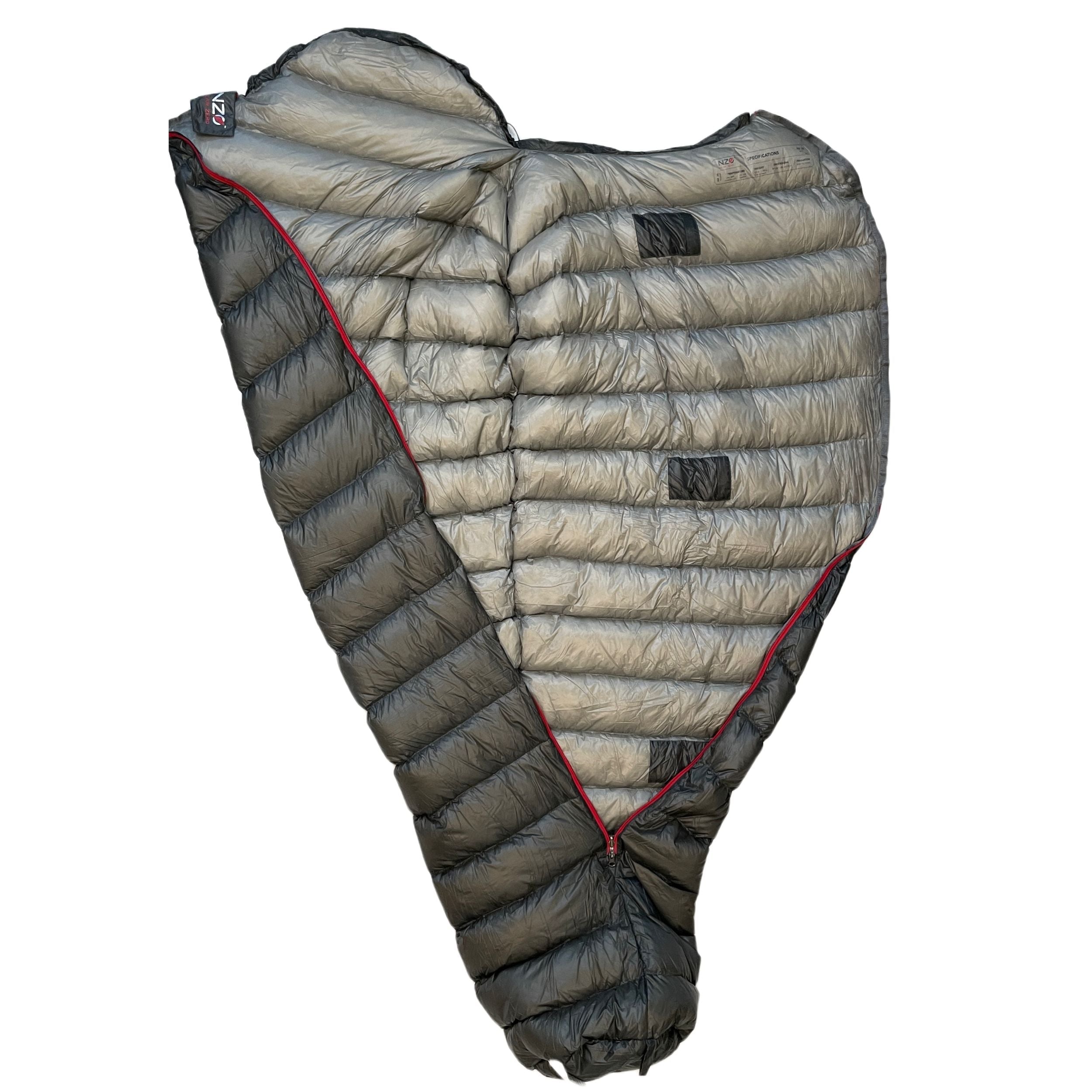 Near Zero Outdoor Gear NZ 35 mummy sleeping bag laid out, showcasing its tapered shape and insulated exterior for camping comfort.