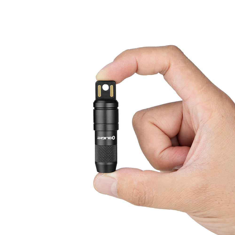 Olight iMini 2 rechargeable mini flashlight with keychain attachment, showcasing compact design and bright 50 lumens output.