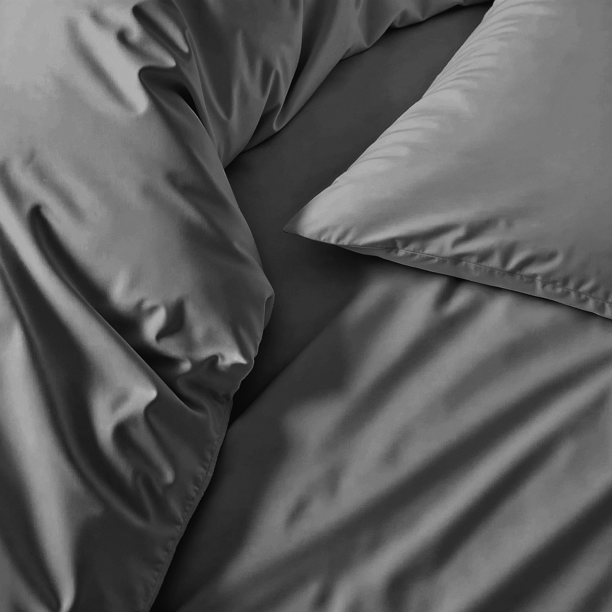 Elegant Luxe Australian Sateen Duvet Cover by Italic displayed on a neatly made bed with soft, luxurious fabric visible.