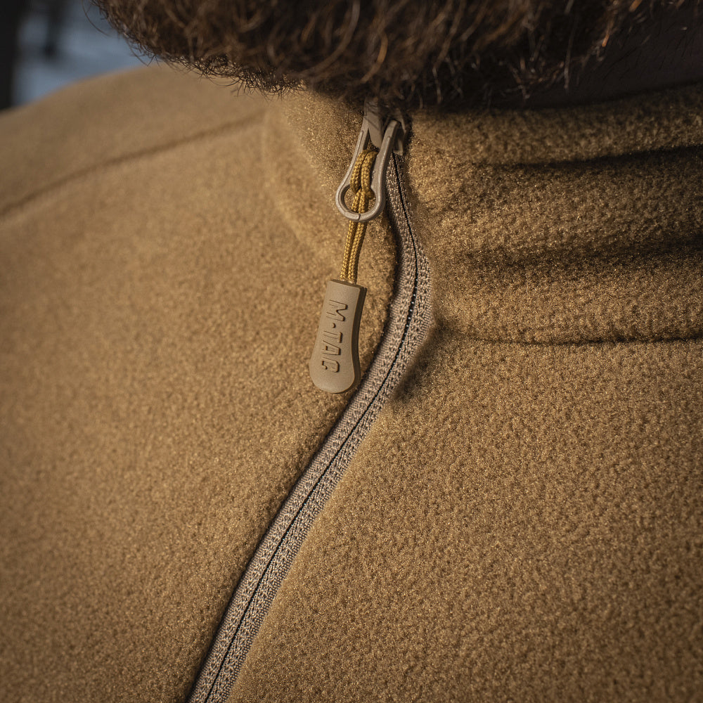 M-TAC fleece jacket in black, made with Polartec fabric, showcasing a comfortable, sporty design for outdoor activities.