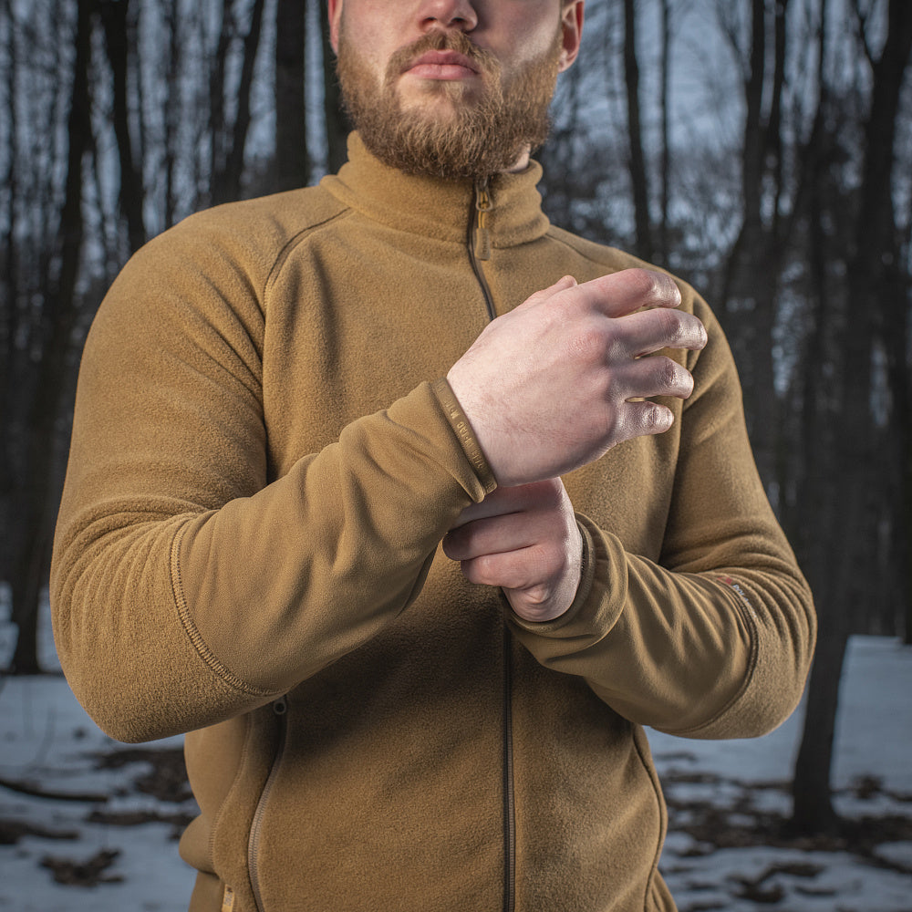 M-TAC Polartec Sport fleece jacket in dark color, showcasing a soft texture and practical design for outdoor activities.