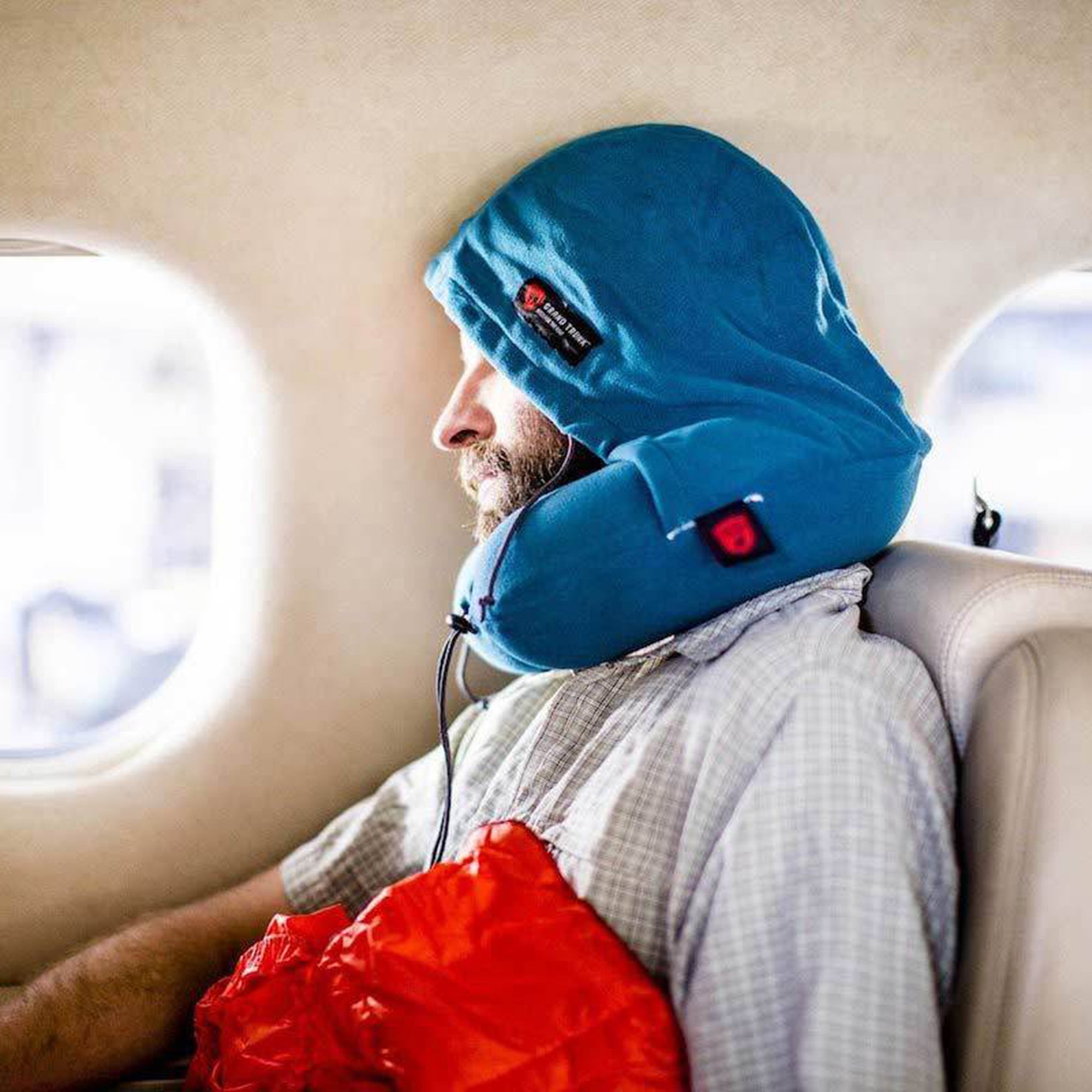 GrandTrunk hooded travel neck pillow in a cozy design, perfect for comfort during long trips.