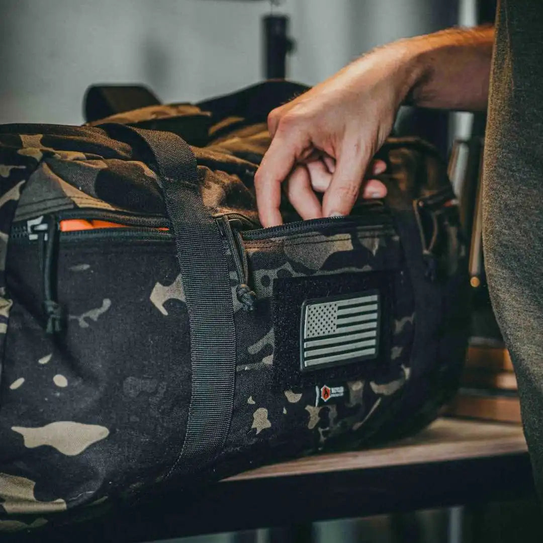 Recycled Firefighter 72-Hour 500D Cordura duffle bag in black with sturdy handles and spacious main compartment, designed for durability.