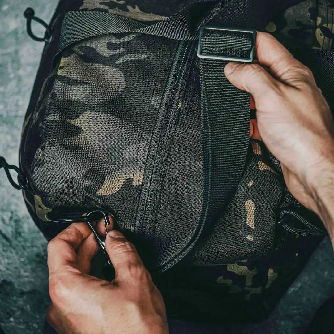 Recycled Firefighter 72-Hour 500D Cordura duffle bag in McAmBlack, showcasing durable outdoor-ready backpack design.