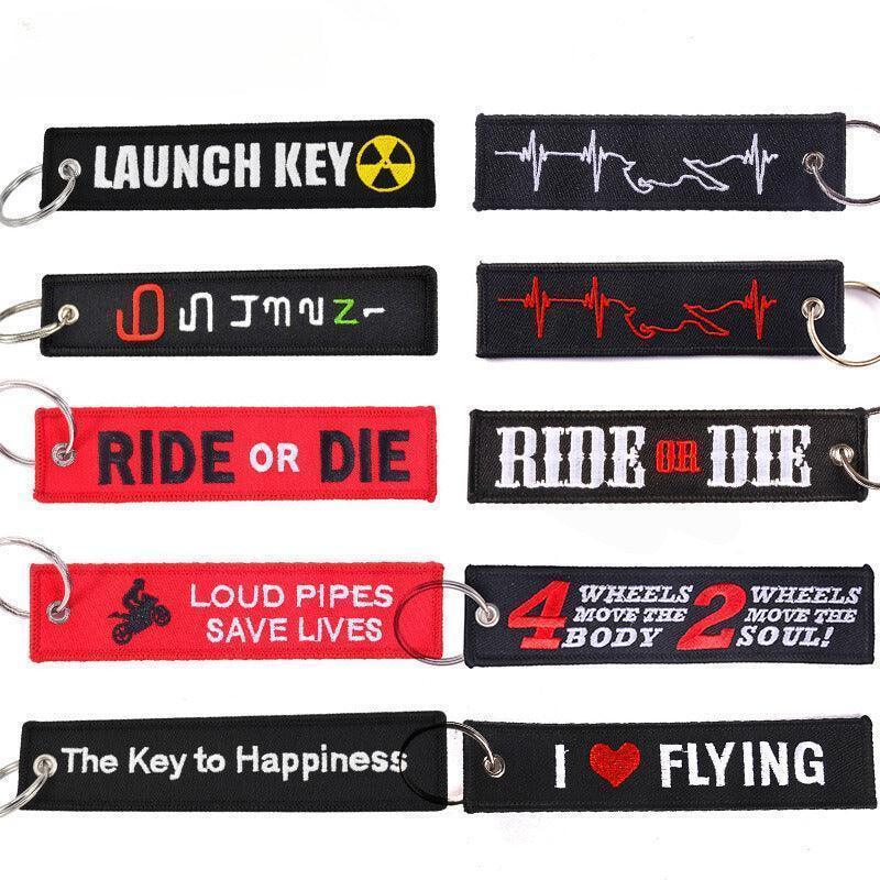 Motorcycle embroidered keychain decor by Bean's Moto Booth, featuring detailed motorcycle design on fabric keychain.