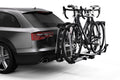 Thule Helium Platform XT 2 bike rack from Backcountry Sportsman mounted on a vehicle, designed for secure bike transportation.
