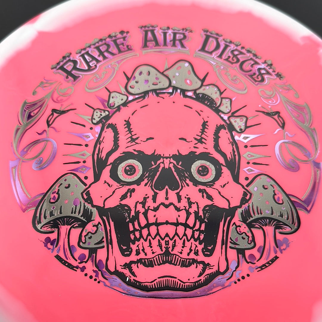 Disc golf disc from Rare Air Discs, Halo S-Blend Tomb - Crushin' Amanitas stamp, featuring colorful mushroom artwork on a vibrant disc.