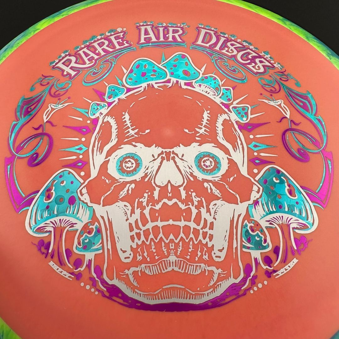 Rare Air Discs Fission Defy Crushin' Amanitas VIP 2.0 disc golf disc, vibrant design and detailed branding on the flying disc.