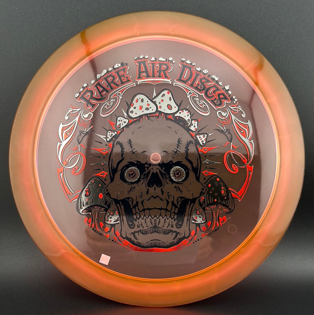 Ethos Construct Crushin' Amanitas disc golf stamp by Manny Trujillo on a Rare Air Discs disc, featuring colorful mushroom artwork.