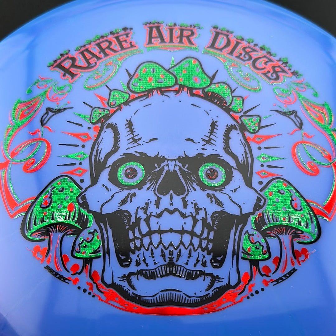 Ethereal Construct Crushin' Amanitas disc golf stamp by Manny Trujillo on a Rare Air Discs disc showing detailed mushroom artwork.