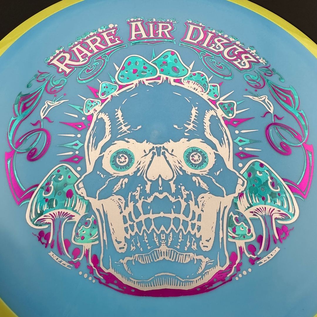 Rare Air Discs Fission Defy Crushin' Amanitas VIP 2.0 disc golf disc with vibrant graphic design and lightweight plastic material.