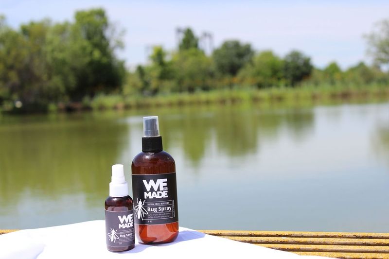 Natural insect repellent spray by WE Made with botanical ingredients, designed to keep bugs away effectively.